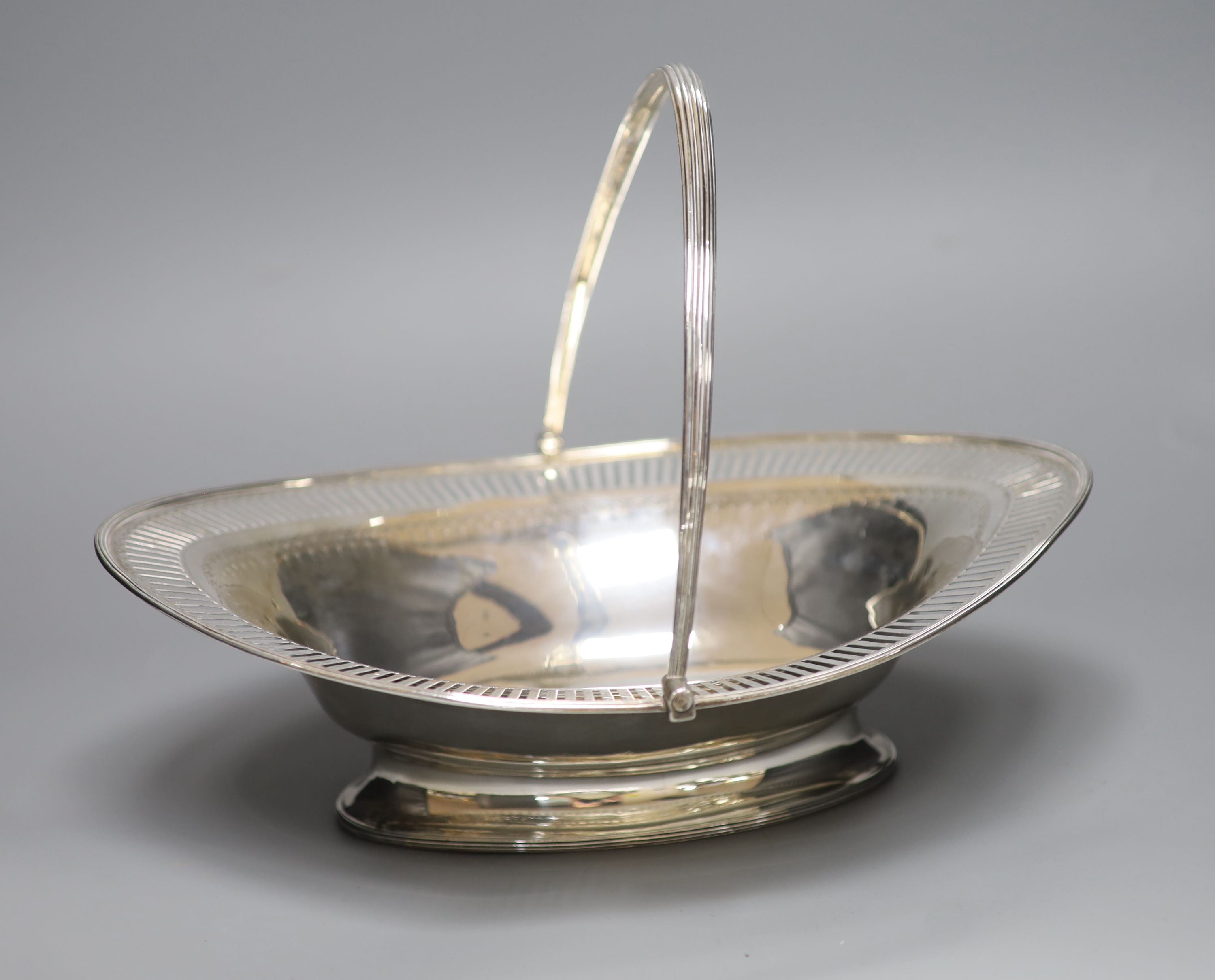 A George III pierced silver oval cake basket, maker's mark rubbed, London, 1786